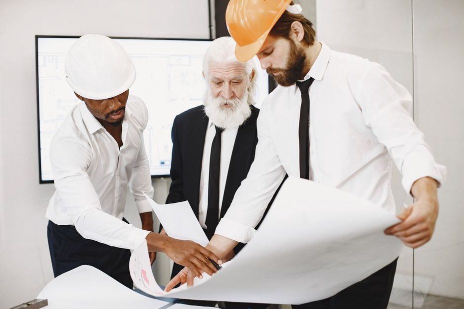 Group of architects examining eco-friendly building designs