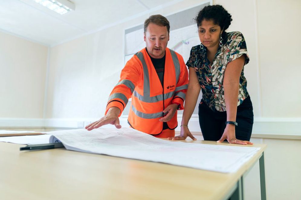 Architects discussing project plans with stakeholders