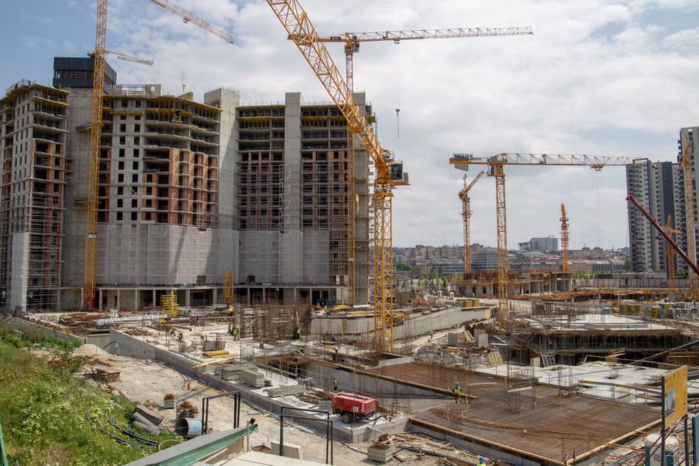 Busy construction site with cranes in action