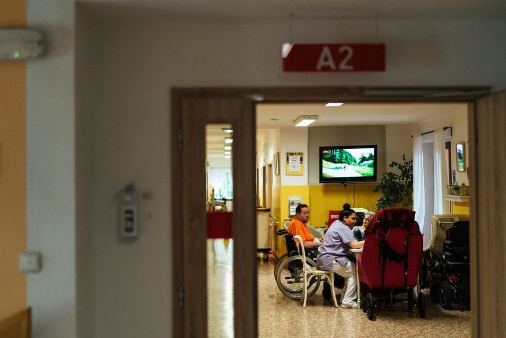 Patients relaxing in a hospital garden courtyard