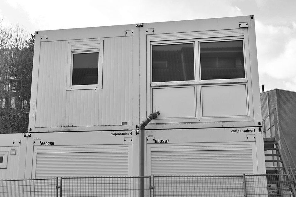 A site with pre-fabricated building modules being assembled