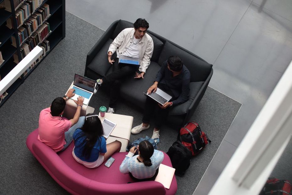 Students collaborating in an open, flexible campus space