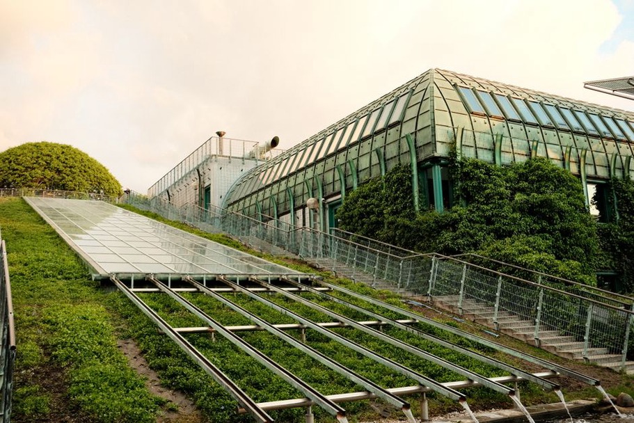 Building seamlessly integrated into a lush natural landscape