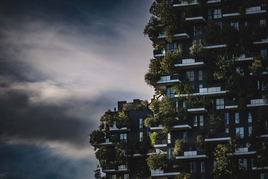 Modern urban buildings with green rooftop gardens