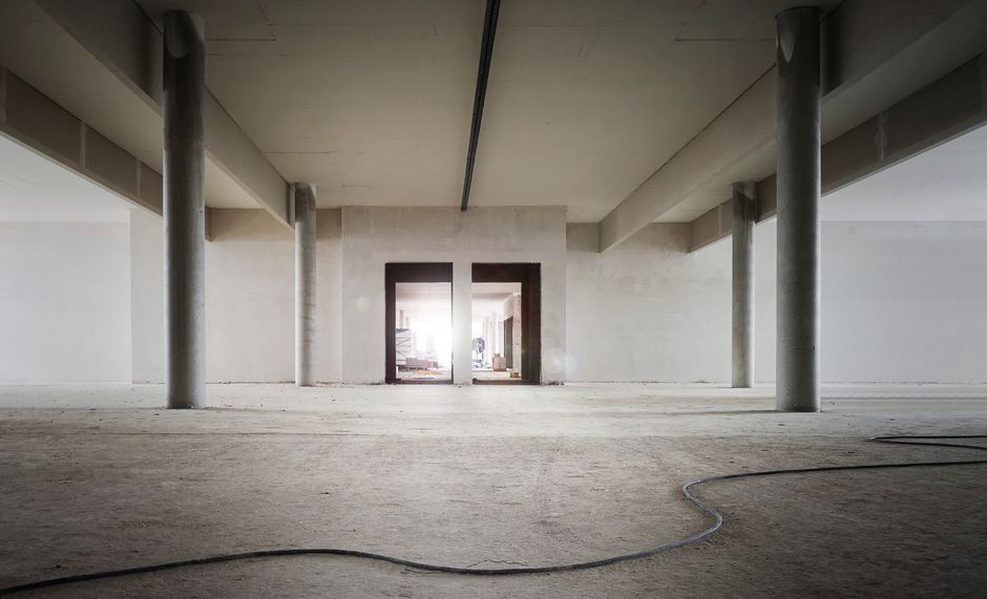 Workers installing isolated ceiling components above offices