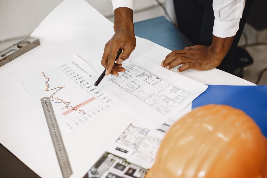 Architect examining detailed building plans
