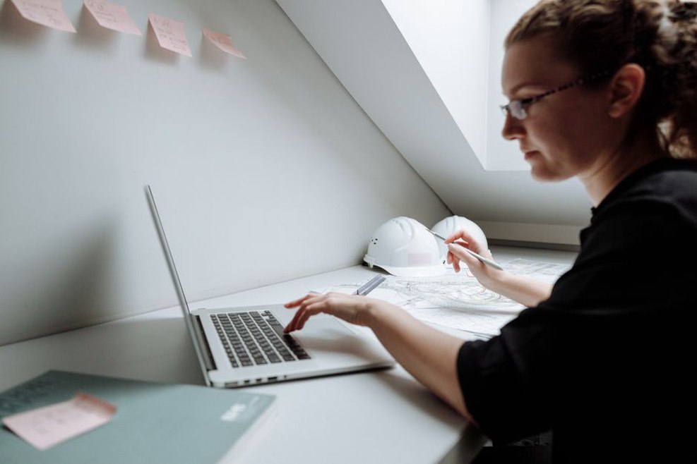 Architect working with BIM software on a computer
