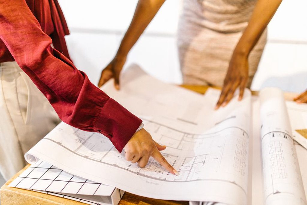 Architects reviewing plans with a focus on sustainability
