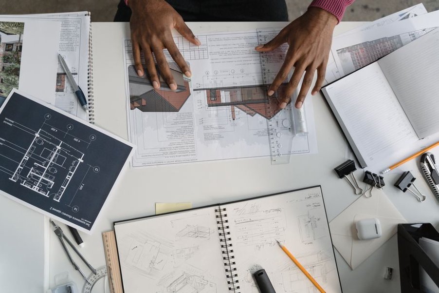 Architectural blueprints annotated with sustainability metrics