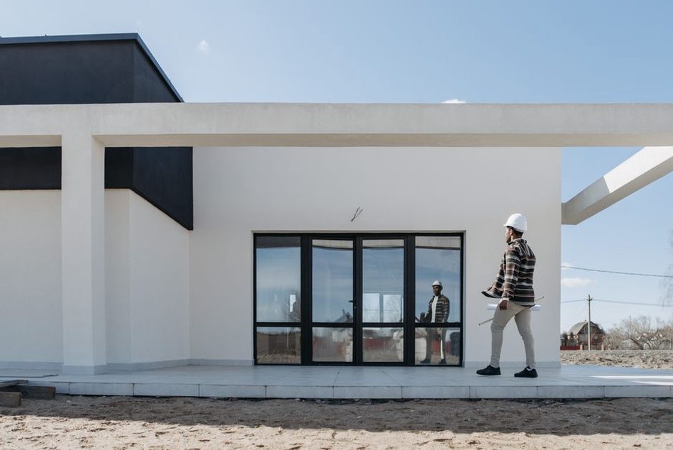 Architect reviewing façade work during site inspection