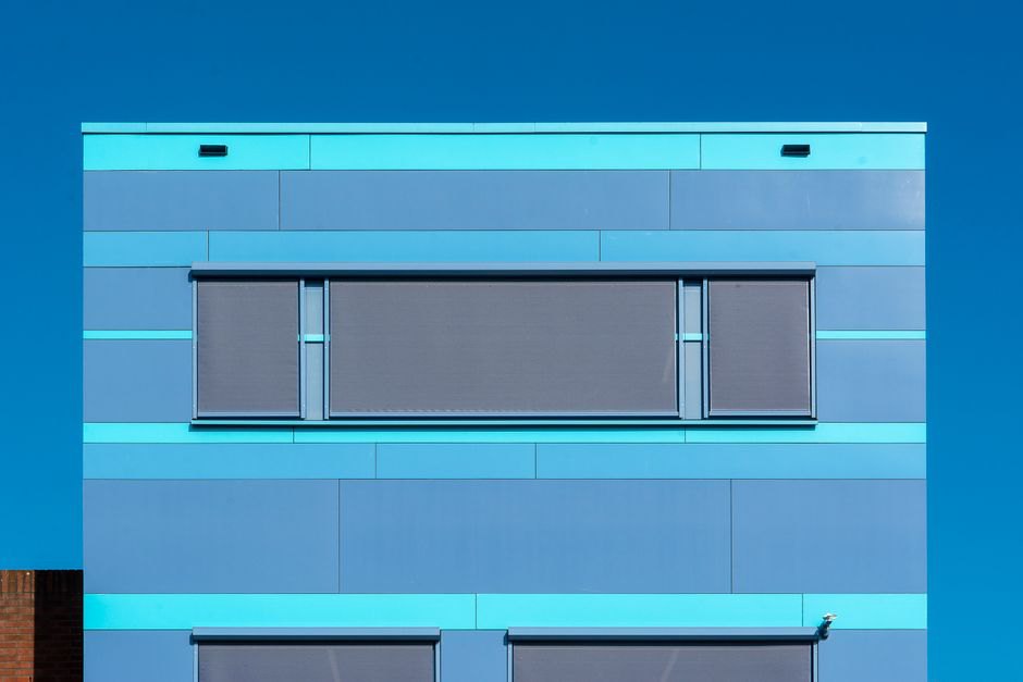 Deep façade shades protect classroom windows from sun
