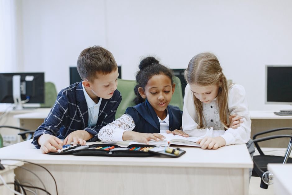Students working at tables with clear circulation space