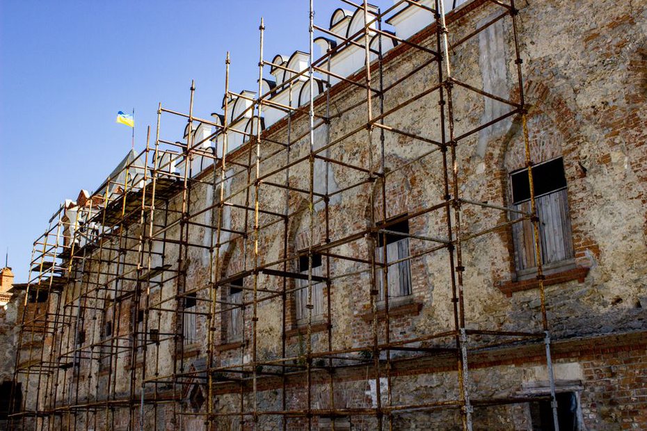 Masonry repair underway on a protected urban façade