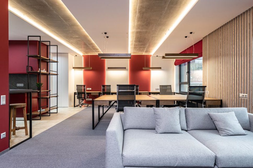 a contemporary workspace with sound-absorbing panels and diverse seating clusters