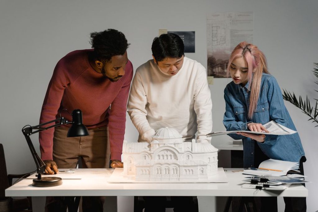 Design team discussing a neighborhood model