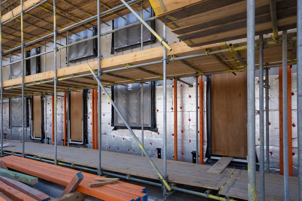 Continuous insulation around a residential window opening