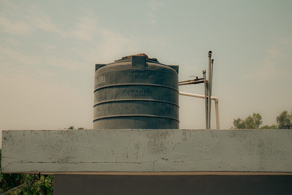 Maintenance access beside rooftop water-management equipment