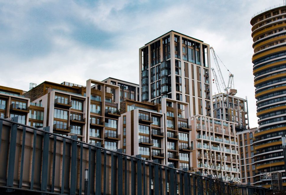 Prefabricated residential modules lifted into a city development