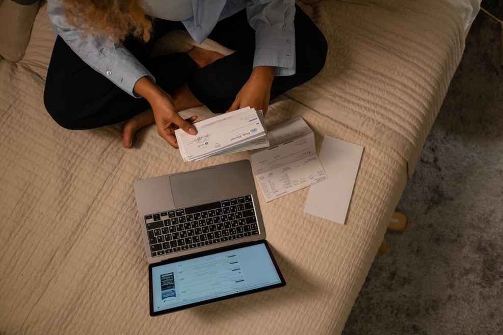 Person reviewing a balance on a laptop