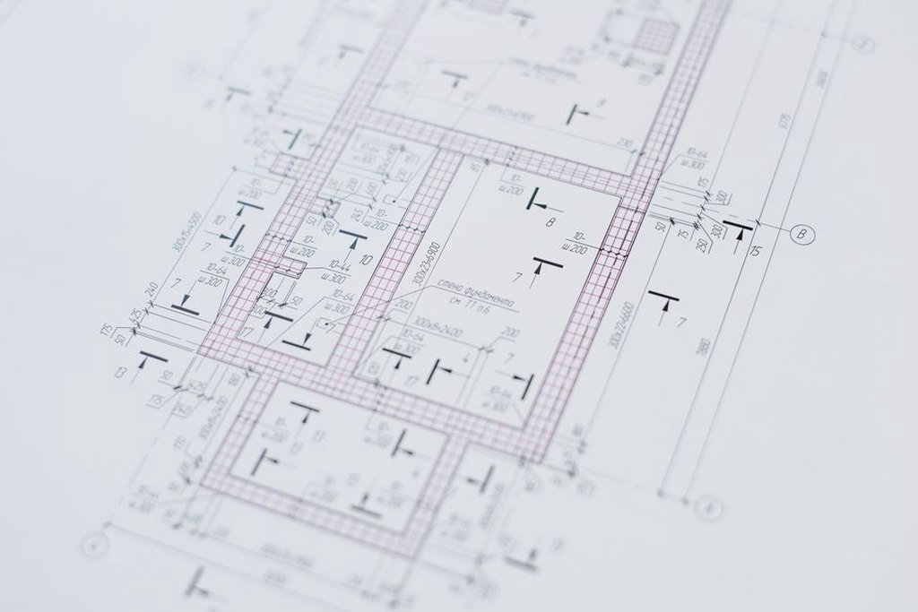 Plans and renderings reviewed side by side