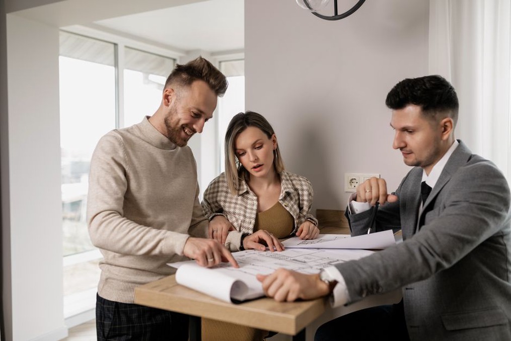 Client and architect compare options on a floor plan