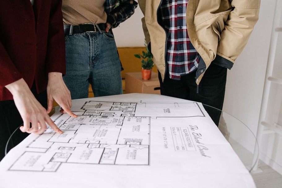 Architect and client reviewing a proposed floor plan