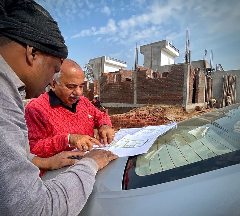 Design team comparing site conditions and building plans