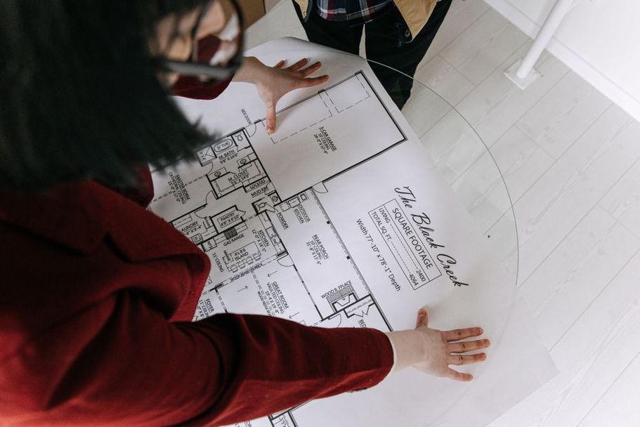 Project team reviewing dates against building plans