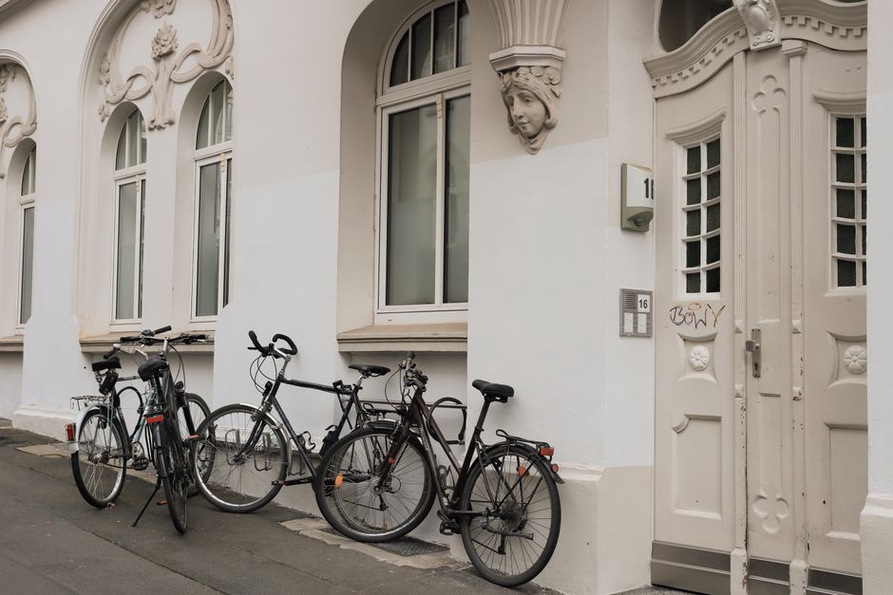 Cycle parking sits beside a clear pedestrian approach