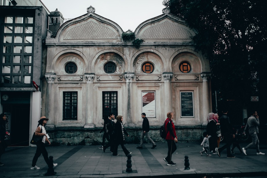 Pedestrians pass an occupied public building