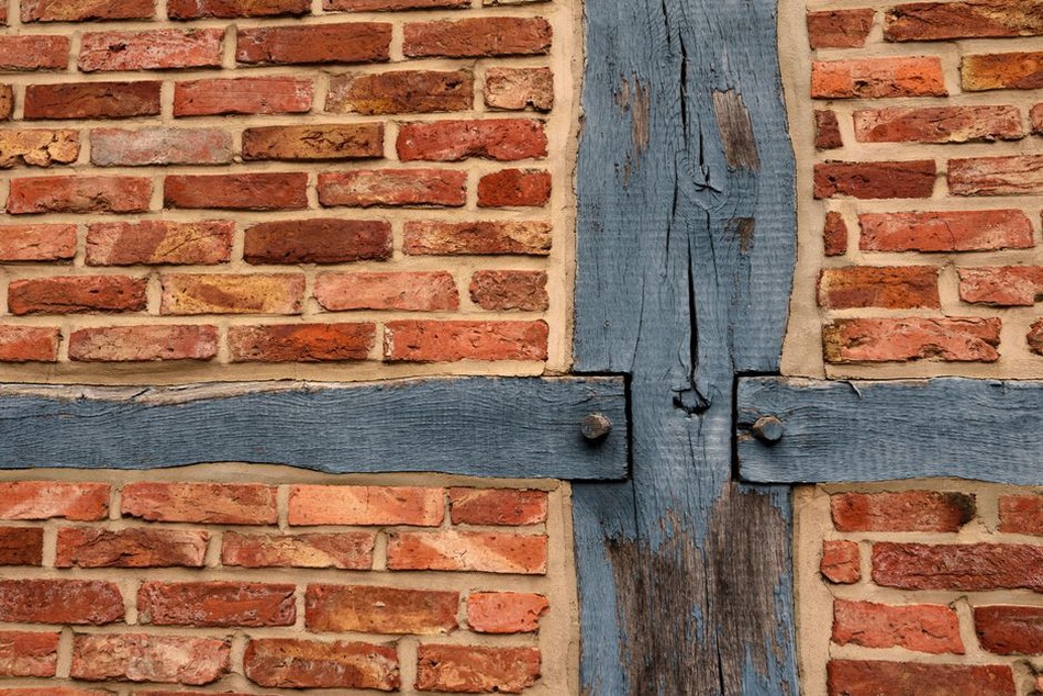 Timber addition meets an existing masonry wall