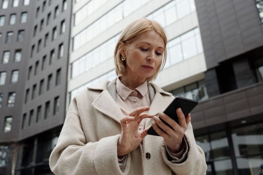 Visitor checks entrance information outside a building