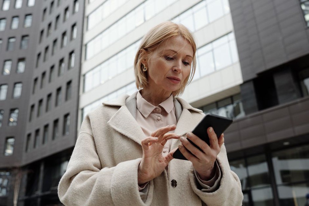 Visitor checks entrance information outside a building