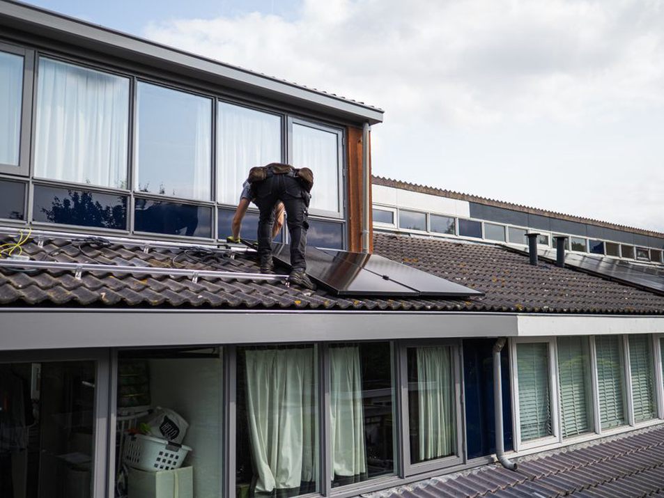 Solar panels beside a clear roof access route